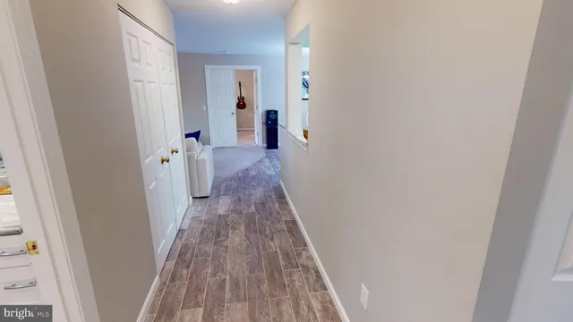 a view of a bathroom from the hallway