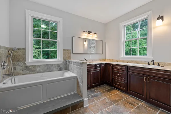 a bathroom with a shower and a bathtub