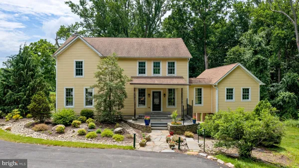 an aerial view of a house with a lake view