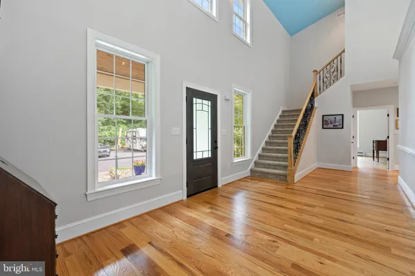 a view of a room with wooden floor and staircase