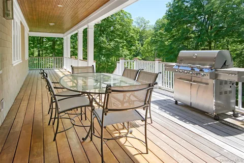 a view of a patio with a table and chairs