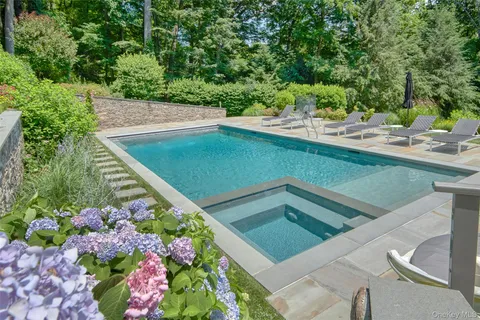 a view of a swimming pool with a yard