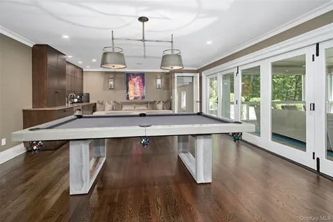 a view of a room with wooden floor and windows