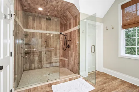 a bathroom with a bath tub and shower