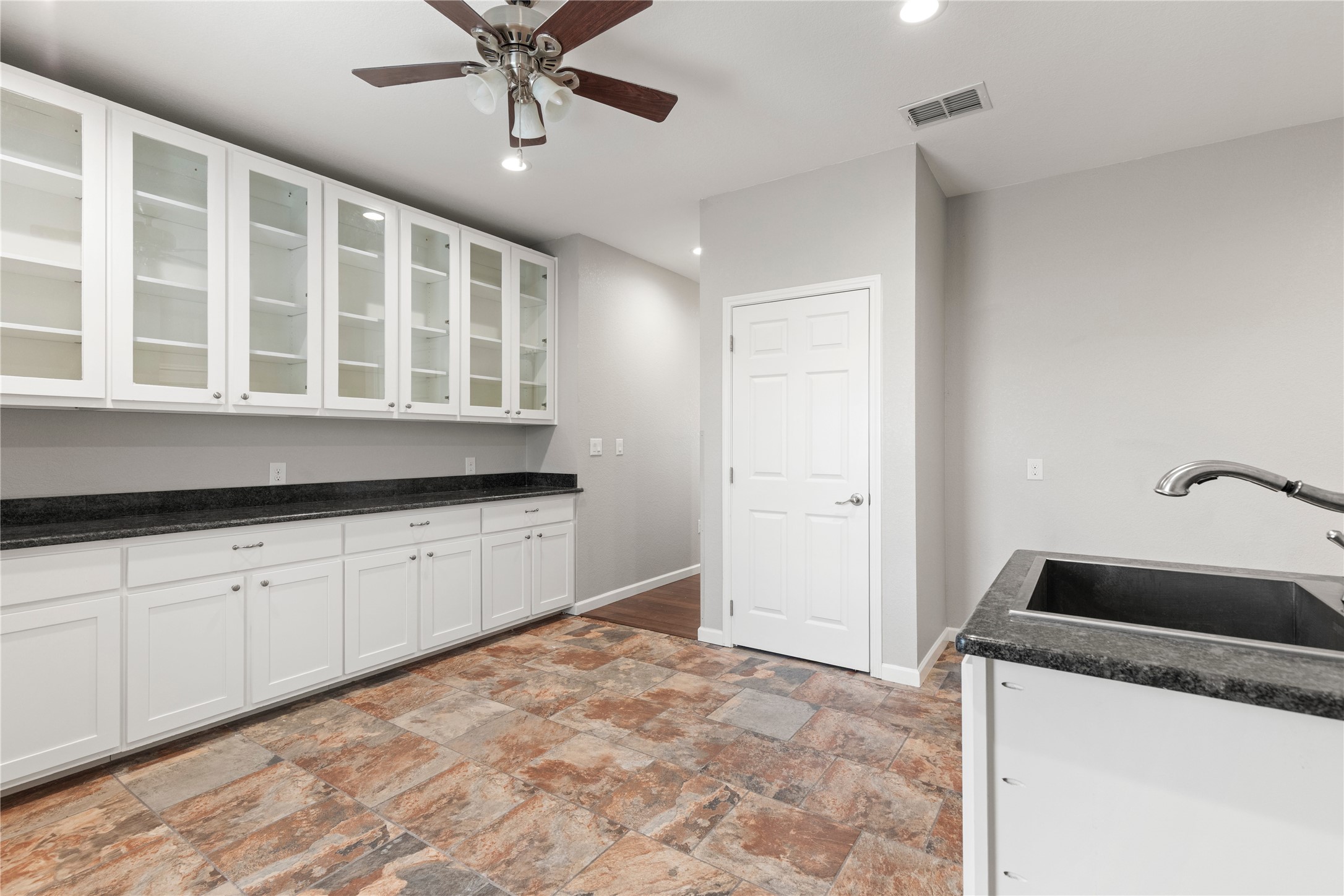 1293 Pioneer Road Seguin, TX 78155 - Photo 13 of 40 Functional workspace with extensive storage, a convenient sink, and overhead illumination for optimal productivity.