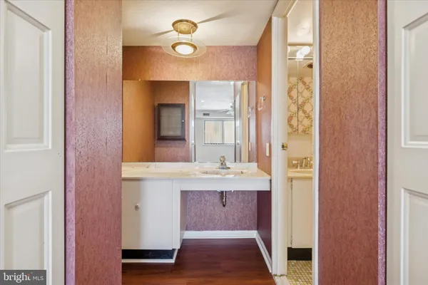 a bathroom with a double vanity sink and a mirror