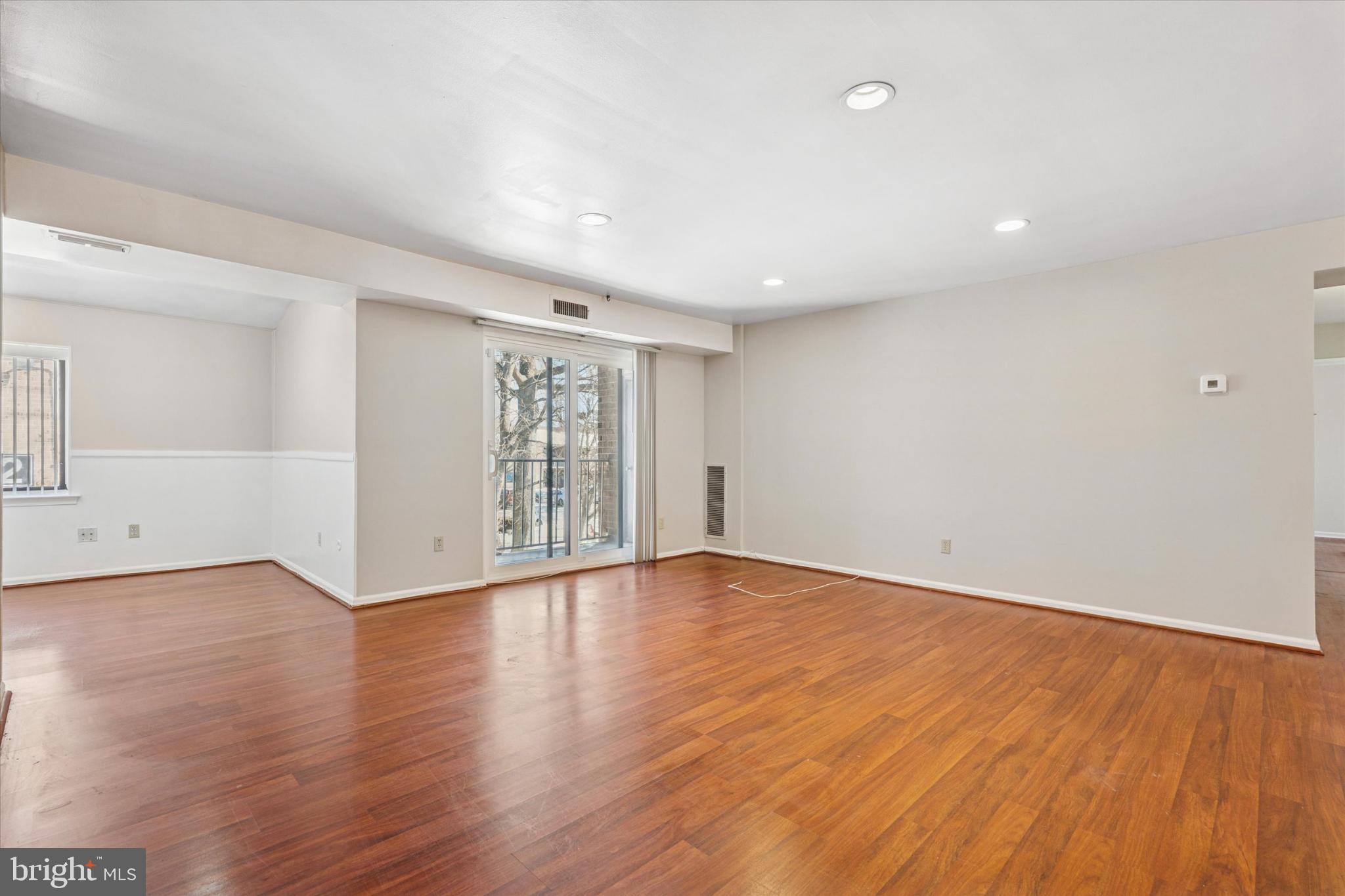 3204 Delaire Landing Road, Unit 3204 Philadelphia, PA 19114 - Photo 2 of 25 Spacious, sunlit living area with hardwood floors.
