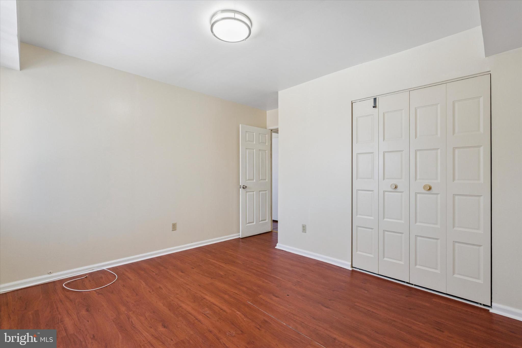 3204 Delaire Landing Road, Unit 3204 Philadelphia, PA 19114 - Photo 22 of 25 Spacious room with warm wood flooring.