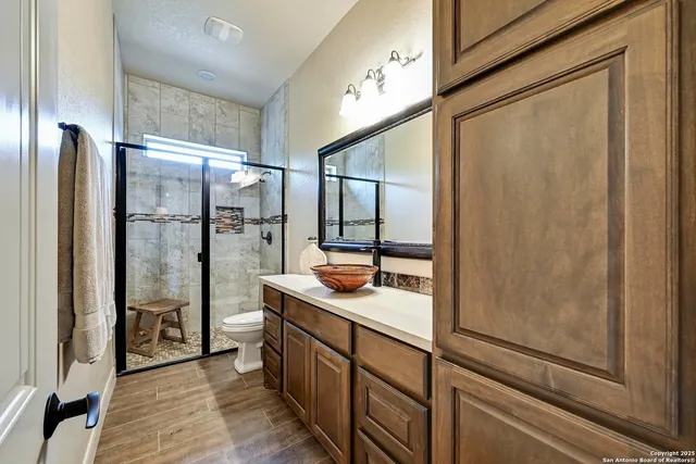 a bathroom with a shower and a sink