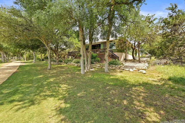 a view of outdoor space with deck and garden