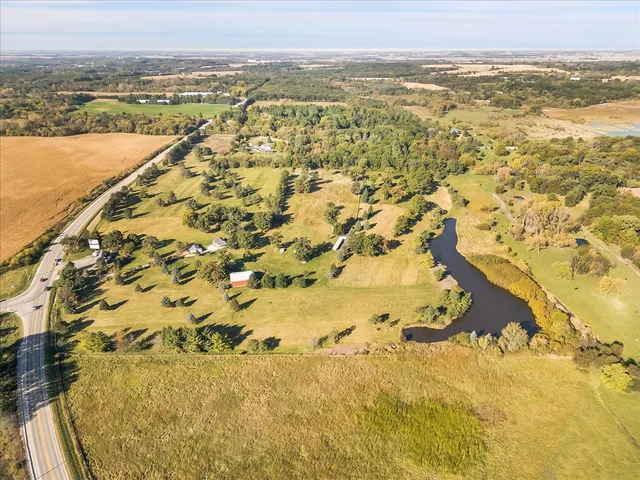 a white and green view of a lake