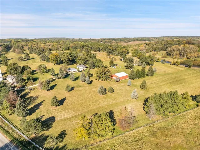 a view of an outdoor space and yard from the back