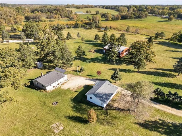 an aerial view of residential houses with outdoor space