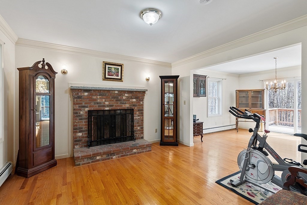 214 Hastings Road Ashburnham, MA 01430 - Photo 14 of 39 a living room with furniture and a fireplace