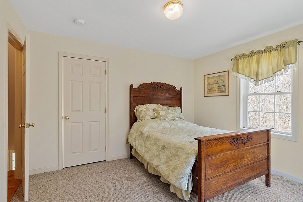 214 Hastings Road Ashburnham, MA 01430 - Photo 25 of 39 a bedroom with a bed and window