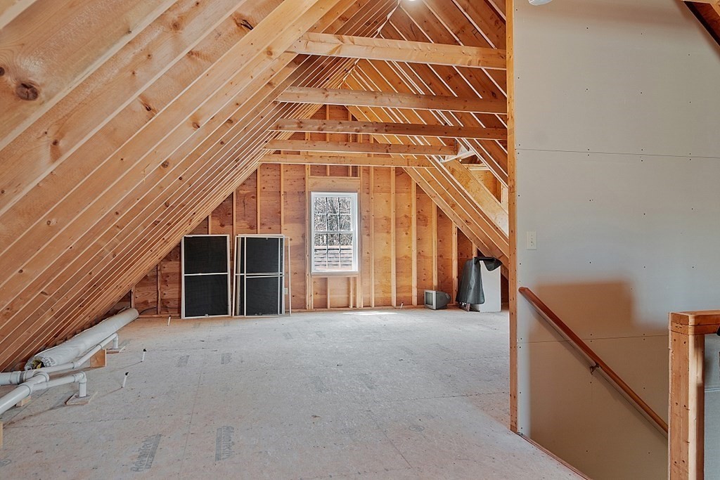 214 Hastings Road Ashburnham, MA 01430 - Photo 31 of 39 a view of a big room with wooden stairs and windows