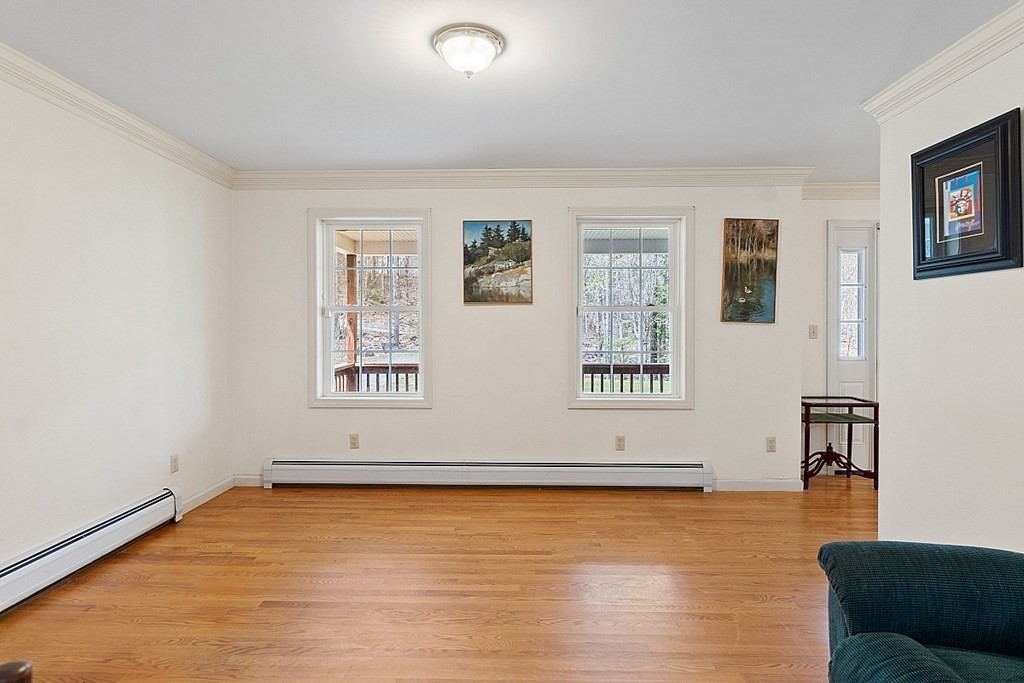 214 Hastings Road Ashburnham, MA 01430 - Photo 8 of 39 a view of an empty room with glass door