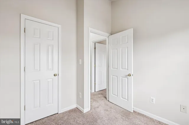 a view of a hallway with closet area