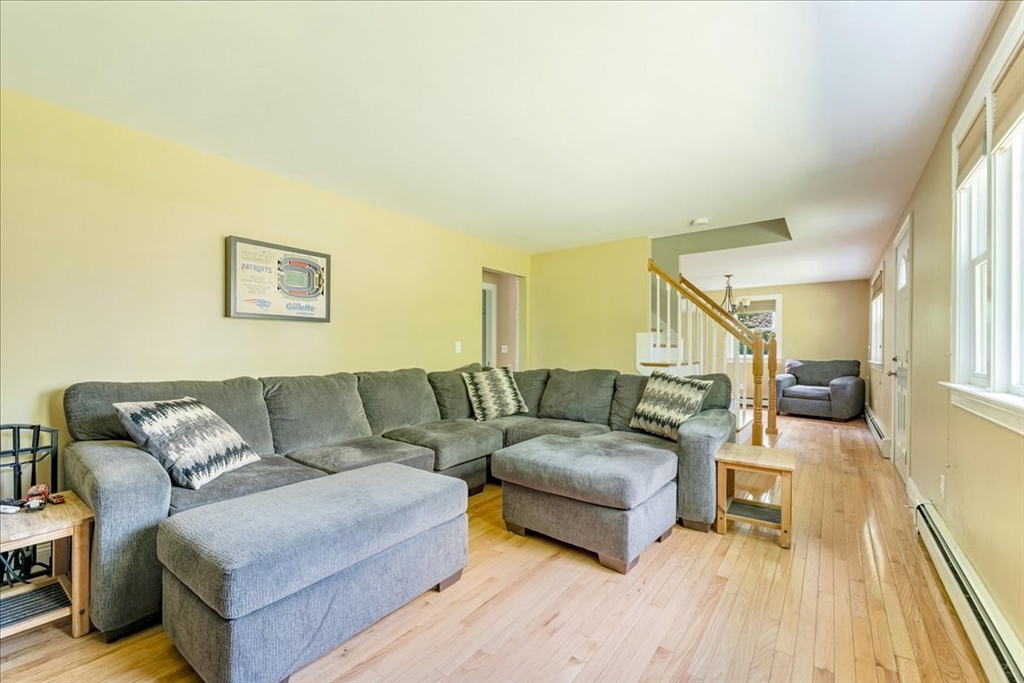 152 Alley Road Rochester, MA 02770 - Photo 14 of 26 a living room with furniture and a wooden floor