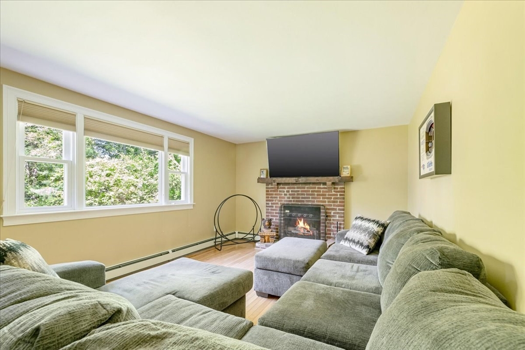 152 Alley Road Rochester, MA 02770 - Photo 16 of 26 a living room with furniture and a flat screen tv