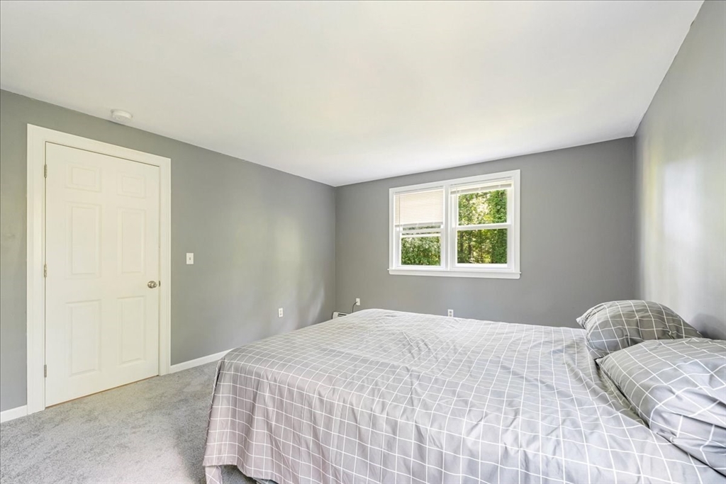 152 Alley Road Rochester, MA 02770 - Photo 18 of 26 a bedroom with a bed and a window