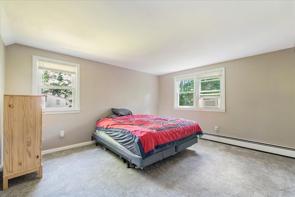 152 Alley Road Rochester, MA 02770 - Photo 20 of 26 a spacious bedroom with a bed and a window