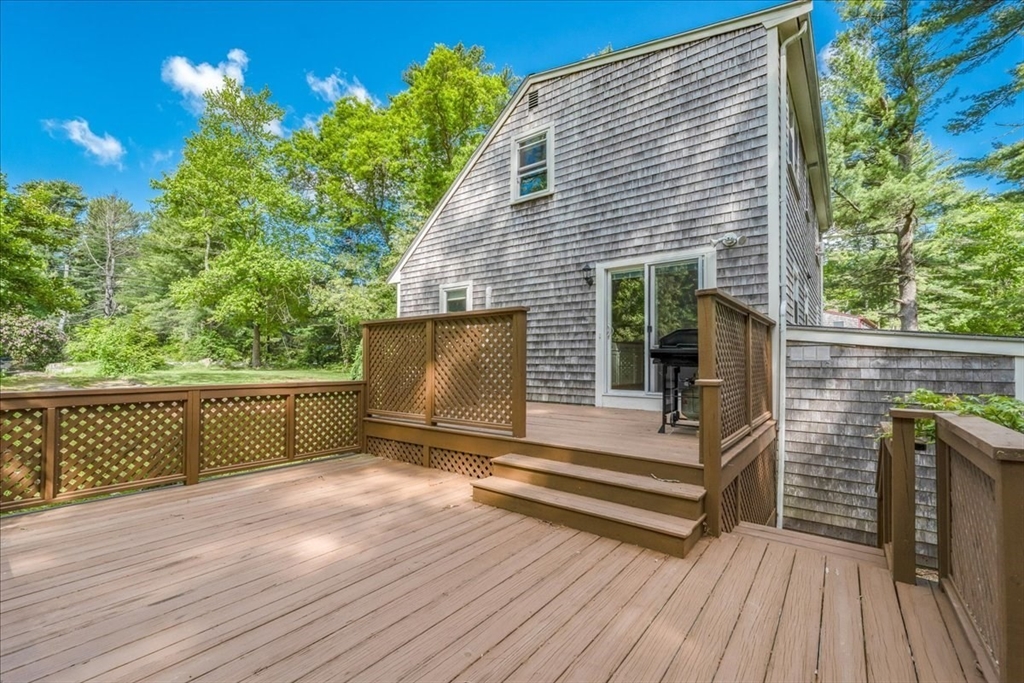 152 Alley Road Rochester, MA 02770 - Photo 22 of 26 a view of backyard with wooden floor and seating space