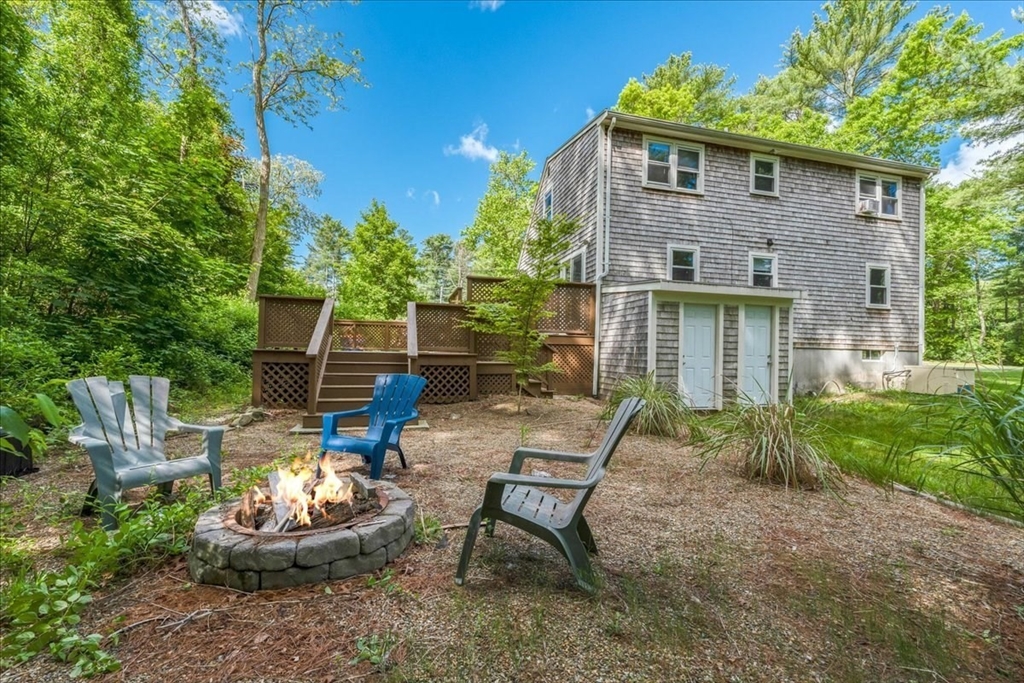 152 Alley Road Rochester, MA 02770 - Photo 23 of 26 a front view of a house with a yard and sitting area