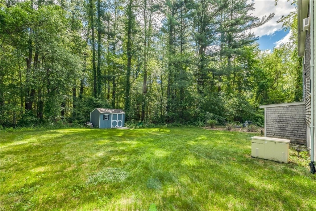 152 Alley Road Rochester, MA 02770 - Photo 26 of 26 a house view with a sitting space and garden