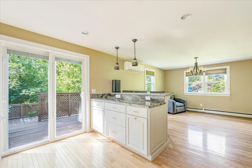 152 Alley Road Rochester, MA 02770 - Photo 10 of 26 a kitchen with stainless steel appliances granite countertop a stove and a wooden floors