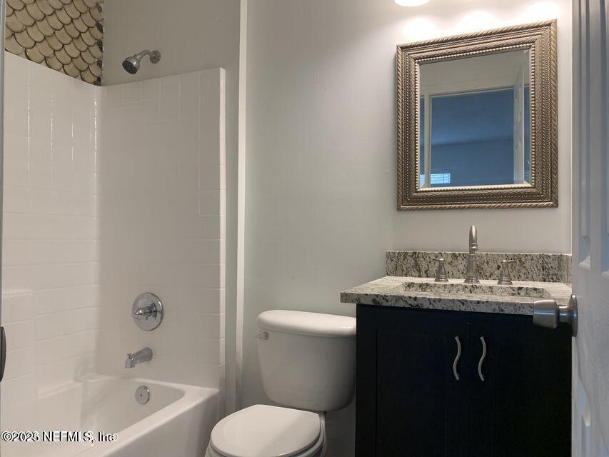 5653 Ellis Trace Drive Jacksonville, FL 32205 - Photo 12 of 12 a bathroom with a sink toilet and tub