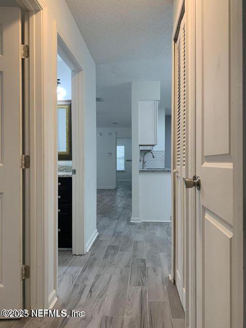 5653 Ellis Trace Drive Jacksonville, FL 32205 - Photo 8 of 12 wooden floor with a bathroom