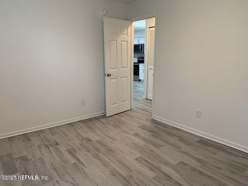 5653 Ellis Trace Drive Jacksonville, FL 32205 - Photo 9 of 12 wooden floor in an empty room