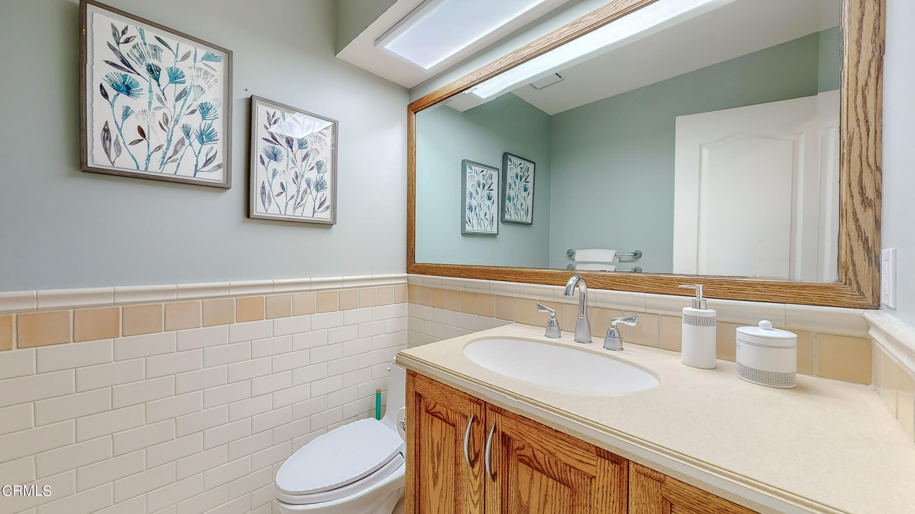 2124 Lenore Drive Glendale, CA 91206 - Photo 17 of 33 a bathroom with a sink a toilet and a mirror