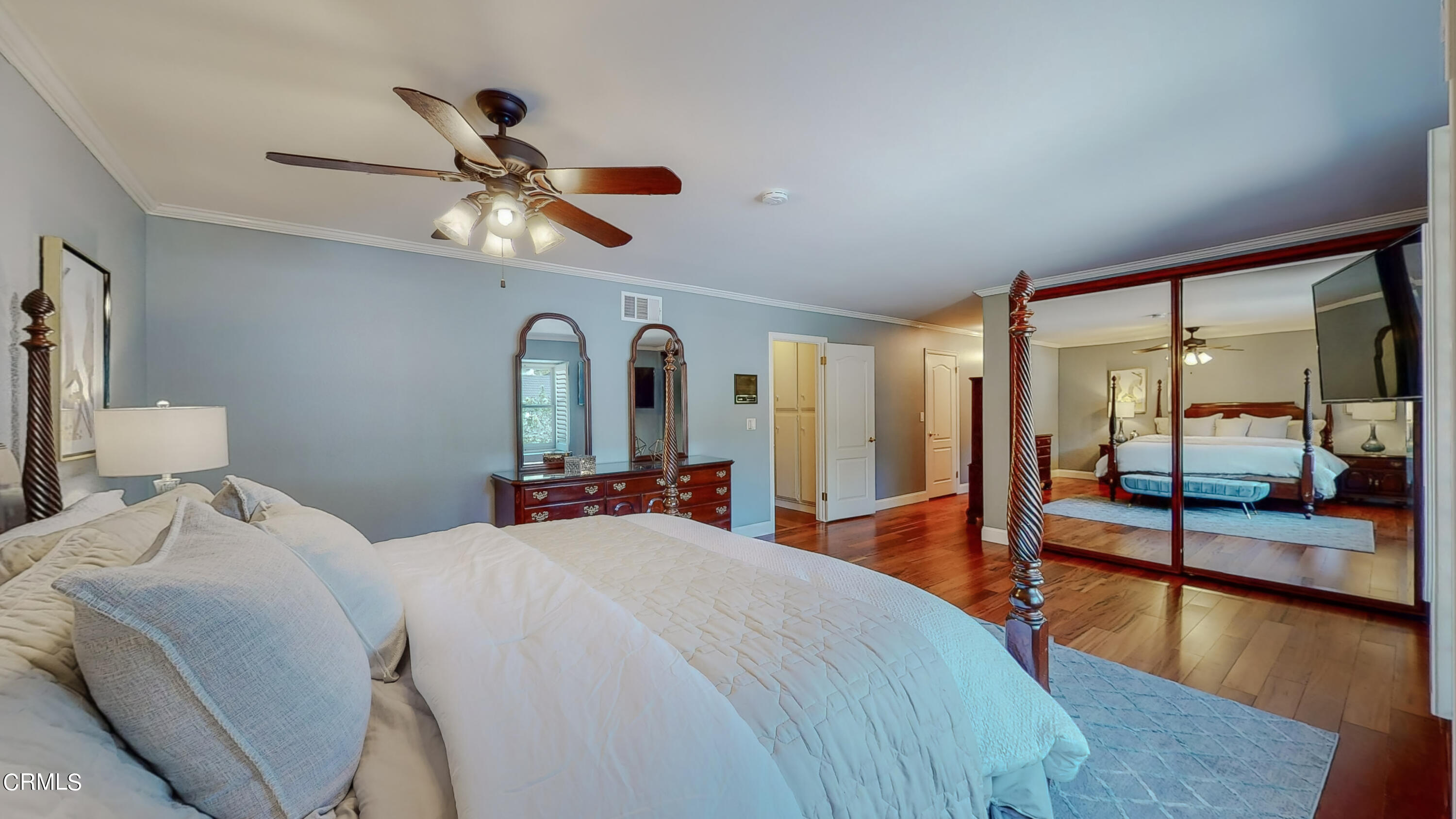 2124 Lenore Drive Glendale, CA 91206 - Photo 20 of 33 a bedroom with a large bed and a chandelier