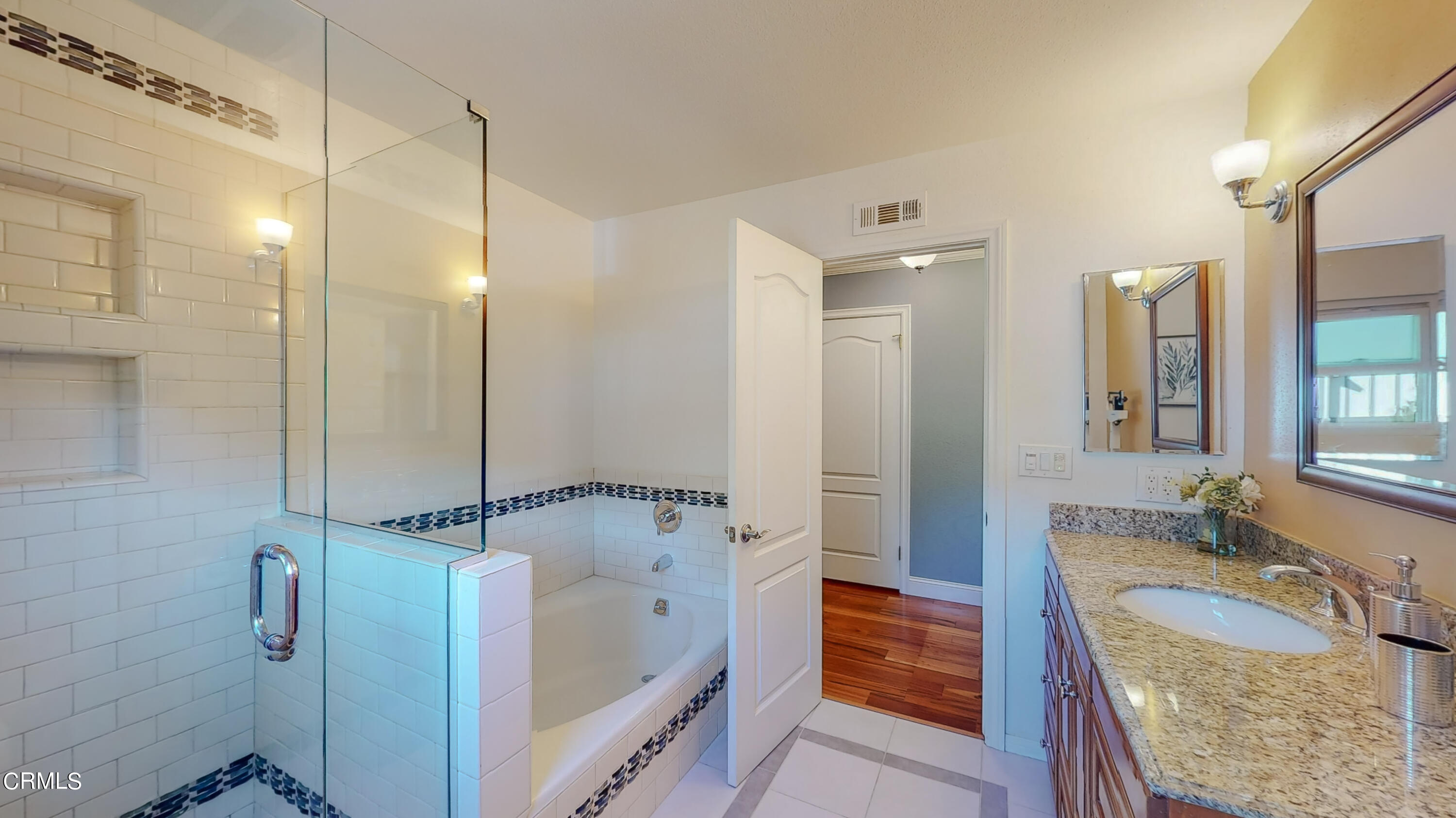 2124 Lenore Drive Glendale, CA 91206 - Photo 22 of 33 a bathroom with a granite countertop tub sink and mirror