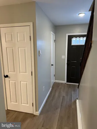 a white toilet sitting next to a small sink