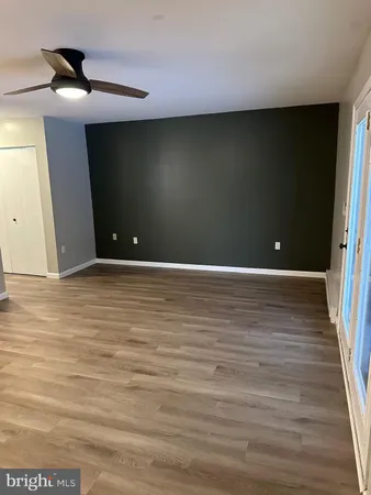 a view of room with wooden floor