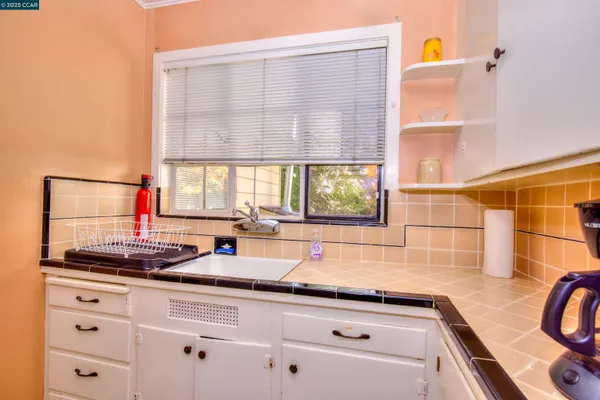 a kitchen with a sink and a window