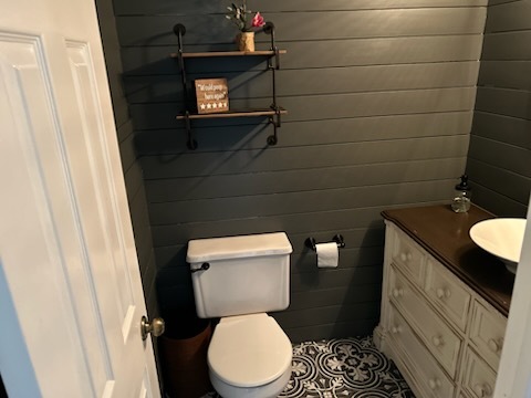 29 Ivanhoe Lane Cary, IL 60013 - Photo 11 of 36 a white toilet sitting next to a bathroom sink and a mirror