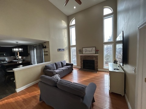 29 Ivanhoe Lane Cary, IL 60013 - Photo 13 of 36 a living room with furniture a large window and a fireplace