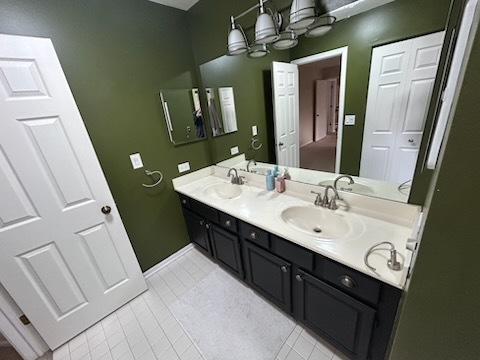 29 Ivanhoe Lane Cary, IL 60013 - Photo 18 of 36 a bathroom with a double vanity sink and a mirror
