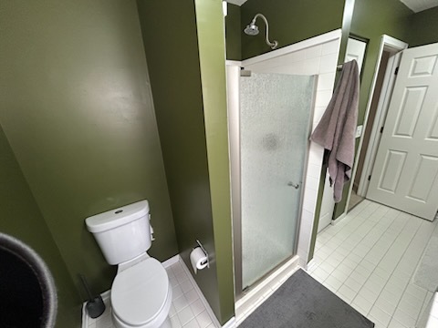 29 Ivanhoe Lane Cary, IL 60013 - Photo 19 of 36 a white toilet sitting next to a shower