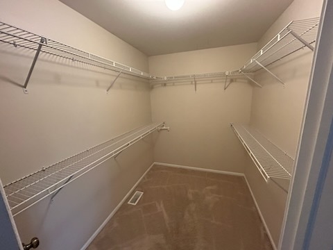 29 Ivanhoe Lane Cary, IL 60013 - Photo 21 of 36 a view of a room with racks on the wall