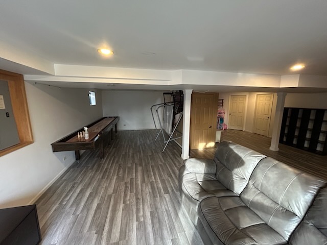 29 Ivanhoe Lane Cary, IL 60013 - Photo 32 of 36 a living room with furniture and a wooden floor