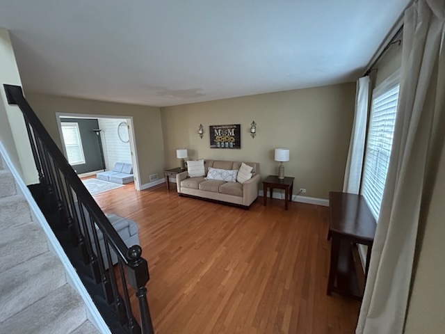 29 Ivanhoe Lane Cary, IL 60013 - Photo 5 of 36 a living room with furniture and a wooden floor