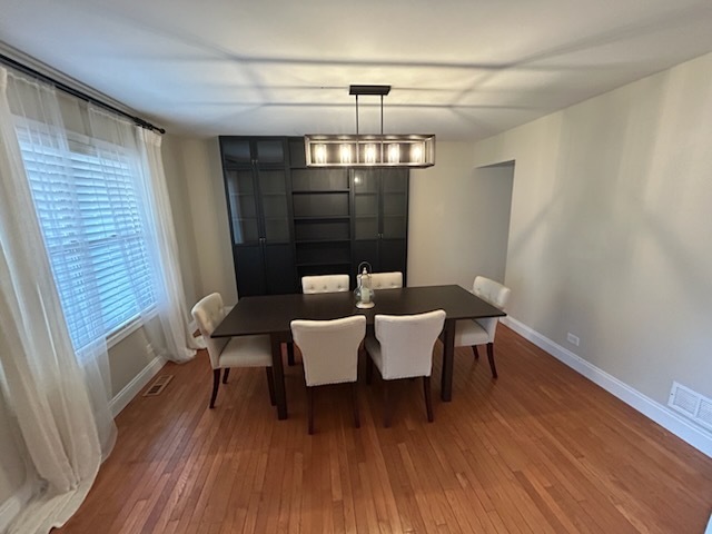 29 Ivanhoe Lane Cary, IL 60013 - Photo 8 of 36 a view of a dining room with furniture wooden floor and chandelier