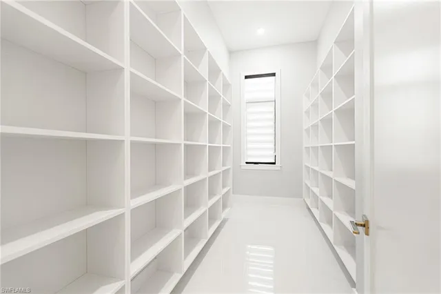 a view of a room with shelves on the wall