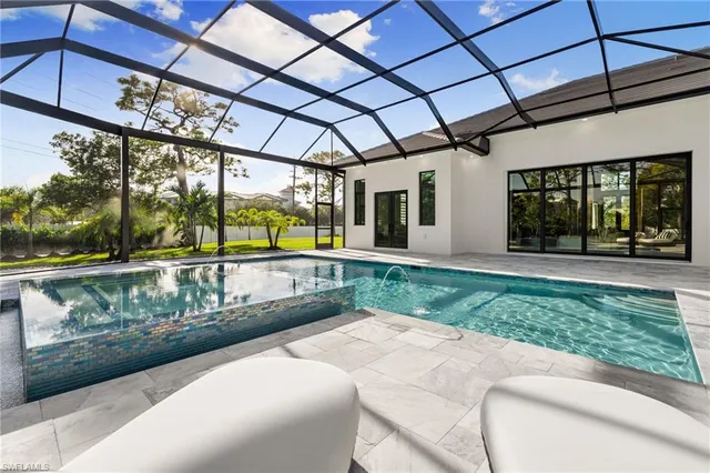 a view of a patio with a table and chairs