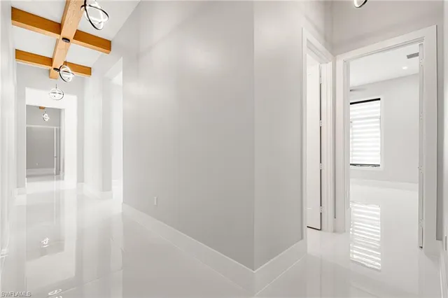 a view of a bathroom from a corridor